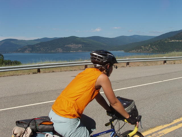 bikes next to a lake and saw-tooth hills